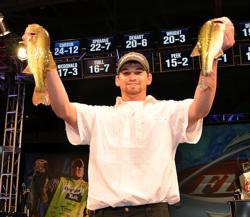 Co-angler winner Keith Carson holds up to of the bass that brought him to the party.