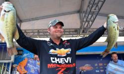 Chevy pro Luke Clausen of Otis Orchards, Wash., shows off his first-place stringer shortly before capturing the tournament title at the FLW Tour Potomac River event.