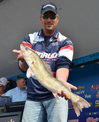 Fourth-place pro Kevin Carstensen holds up his biggest fish from day one. 