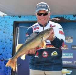 Fifth-place pro Eric Olson holds up his biggest fish from day three on Leech Lake.