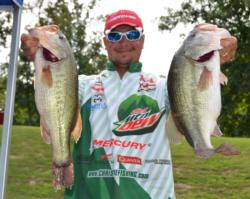 Third-place pro Jason Christie holds up part of his 23-pound, 1-ounce stringer.