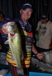 Fifth-place pro Randall Tharp shows off his biggest bass from day one on Lake Ouachita.