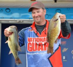 Third-place pro Daryl Biron holds up his two biggest bass from day three on Lake Champlain.