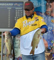Day-three leader David Wolak holds up part of his 19-pound, 13-ounce stringer. 