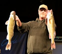 Co-angler John Mickish of White Bear Lake, Minn., brought in five walleyes weighing 26 pounds, 12 ounces Thursday to lead day one of the National Guard FLW Walleye Tour Championship on the Missouri River. 