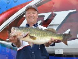 Fourth-place co-angler Timothy Dearing holds up his biggest bass from day two on Lake Okeechobee.