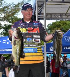 Pro leader Randall Tharp holds up part of his 30-pound, 4-ounce limit Friday afternoon.