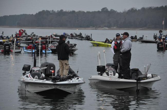 Anglers share a brief conversation with fellow competitors before takeoff.