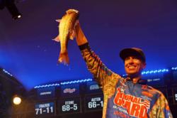 Brent Ehrler of Redlands, Calif., holds up part of his winning catch at the FLW Tour Lake Hartwell event.