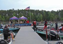 EverStart anglers pause for the National Anthem before taking off for day one.