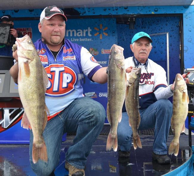Pro Brian Bjorkman and co-angler Keith Keivens hold up part of their 28-pound, 11-ounce final-day stringer.
