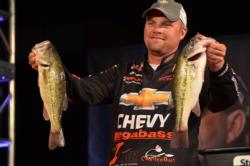 Second-place pro Luke Clausen holds up two nice Beaver Lake largemouths.