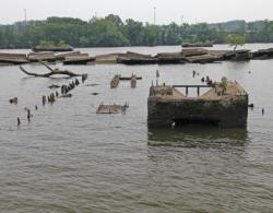 Remnants of long-abandoned barges share Spoils Cove with the more recently deposited rubble from the original Woodrow Wilson Bridge.