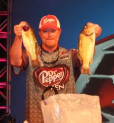 No. 4 pro Kyle Mabrey holds up his two best bass from day three.