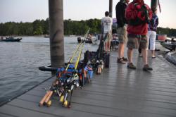 Co-anglers patiently wait with tackle ready to go. 