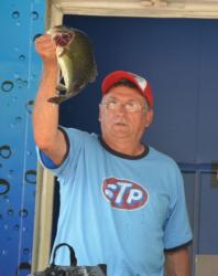 Second-place co-angler Randy Warner holds up his biggest bass from day three on the Mississippi River.
