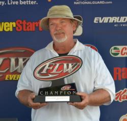 Co-angler champion Rex McTier holds up his trophy for winning the third EverStart Series Central Division qualifier.