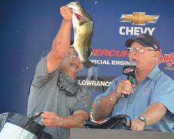 Pro champion Paul Malone holds up a fiesty Mississippi River largemouth.