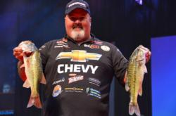 Chevy pro Dion Hibdon proudly displays part of his two-day total catch of 29 pounds. Hibdon currenlty sits in fifth place overall.