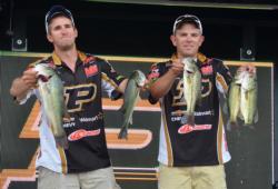Nicholas Schuetz and Elliott Myers show off their bag that put them in third place with 11 pounds, 11 ounces while representing Purdue University. 