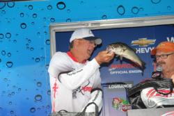 Co-angler winner Mark Howard loads one of his winning fish on day three.
