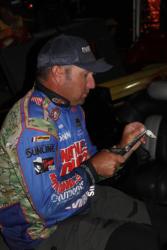 National Guard pro  Brett Hite ties on a crankbait for day four.