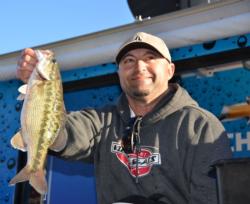 Co-angler Jack Farage of Discovery Bay, Calif., shows off his winning catch shortly before capturing the EverStart Series tournament title on Lake Oroville.