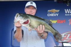 Texas pro T.W. Hardy shows off the 11-pound, 1-ounce whopper that took Big Bass honors.