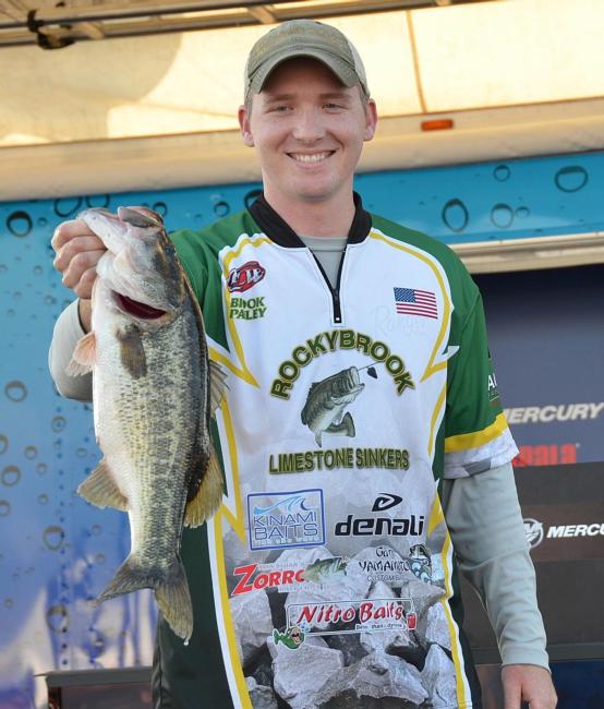 Third-place co-angler Brook Pauley holds up his biggest bass from day three on Lake Okeechobee.