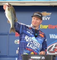 Pro leader Brent Ehrler holds up his biggest bass from day two on Smith Lake. 