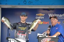 Local pro Derik Hudson of Hurt, Va., with two of his bass that made up his 13-pound, 2-ounce limit on the final day to finish in fourth. 