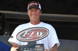 Randy Haynes of Counce, Tenn., proudly displays his first-place trophy after winning the EverStart Series title on Pickwick Lake.