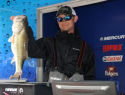 Jordan Lee of Auburn, Ala., shows off his 7-pound bass which took big bass honors in the Pro Division and helped boost him to third place.