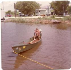 Eight-year-old Troy Broussard in a canoe.