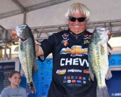 Chevy pro Jimmy Houston of Cookson, Okla., shows off his fourth-place catch on Grand Lake.