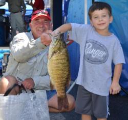Gary Greenwood gets some assistance holding up his 5-pound, 2-ounce smallmouth bass.
