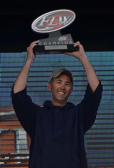 Co-angler champion Jim Hippensteel holds up his hardware. 