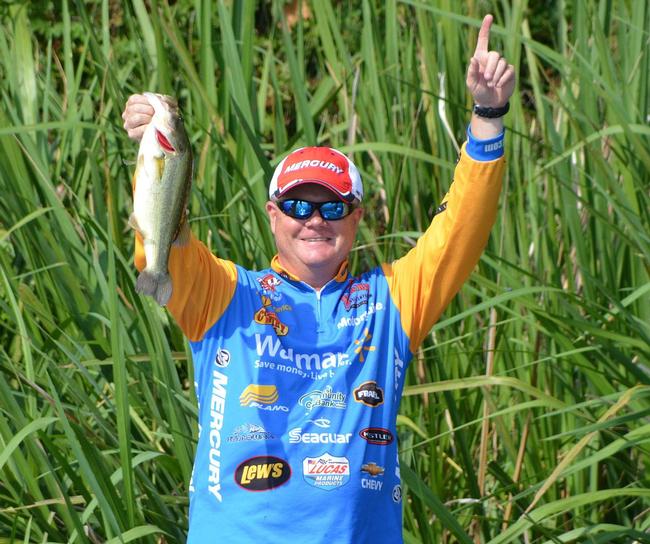 Mark Rose celebrates after catching a 3-pound Red River largemouth. 
