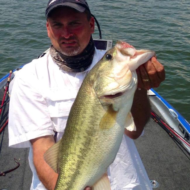 Ken Golub holds up a giant bass he caught during practice for the Lake Chickamauga event.