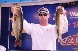 Wade Hudgens of Longview, Texas, is in second place with a five-bass limit weighing 23 pounds, 1 ounce.