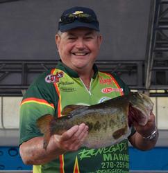 Leon Williams shows off his biggest bass from day three on Lake Okeechobee.