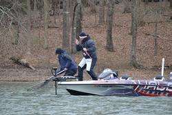 Randall Tharp wrestles fish number five into the boat on day one of the Walmart FLW Tour on Lake Hartwell.