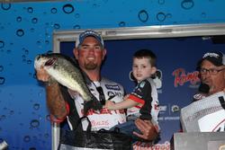 Joined by his son Ash, second-place pro Clark Reehm shows off one of his fish.