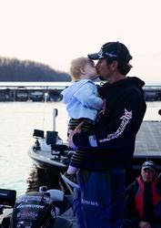 Stetson Blaylock and his son, Kei, share a good-luck kiss before takeoff at the Beaver Lake Walmart FLW Tour event.