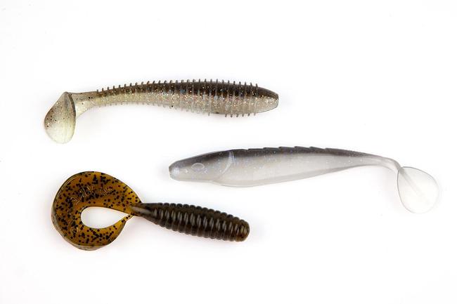 Small, natural-hued swimbaits and grubs work best. Shown here are (top to bottom) a Keitech swimbait, Missile Baits Shockwave swim bait and Strike King Rage Tail Rage Grub.