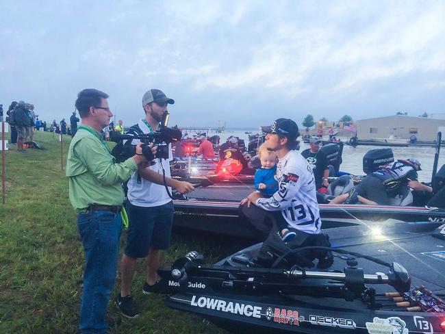 Stetson Blaylock holds his son Kei during the morning interviews at the TTBC on Lake Fork. 