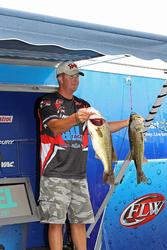 Bryan Schmitt shows off two of his leading fish.