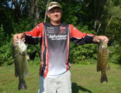 Co-angler Terry Holsapple displays his two best from his 13-4 bag.