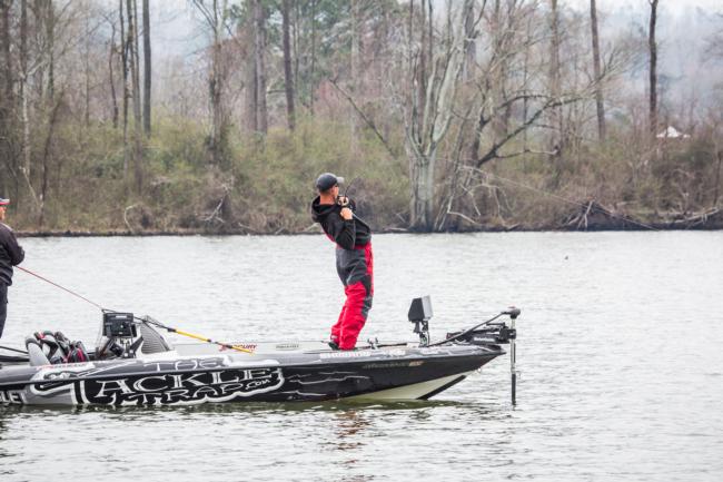 Alex Davis leans way back as he sets the hook on fish three.