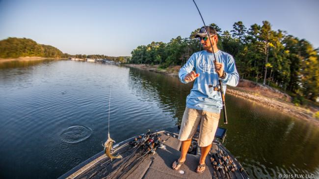 Eventually, Blaylock picked up a rod and began casting. It didn't take long to connect with a small spotted bass. 